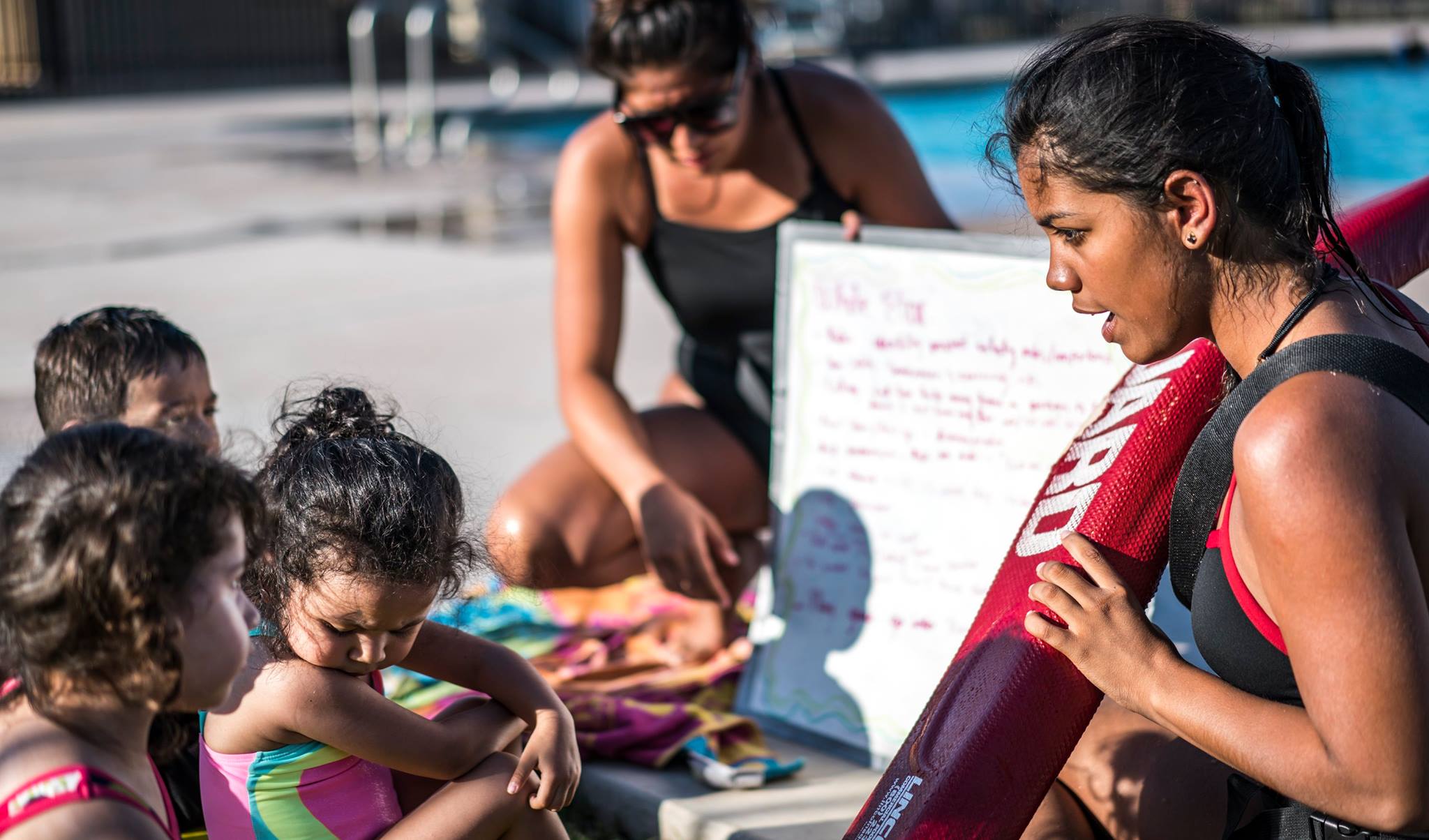 Lifeguard and kids at University Pool