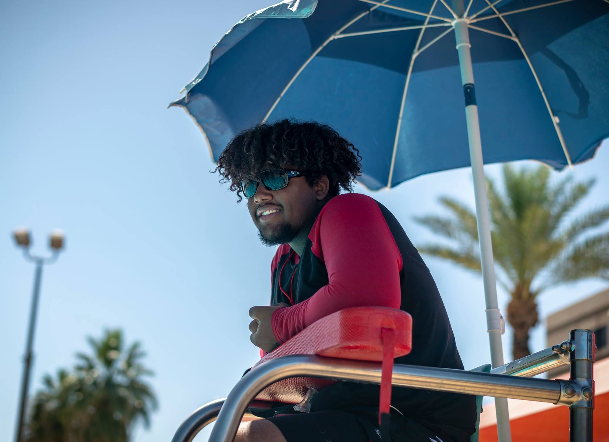 Lifeguard in looking over the pool