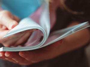 person flipping through journal