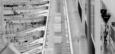 Totes on a conveyor belt in a fulfillment center