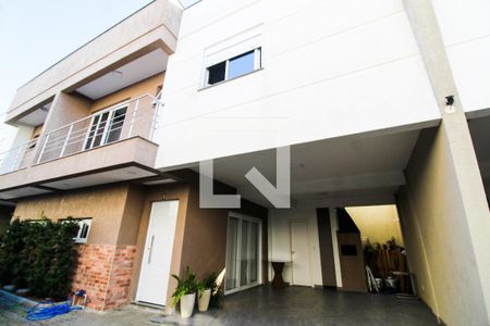 Fachada de casa de condomínio à venda com 3 quartos, 110m² em Niterói, Canoas