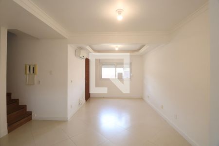 Sala de casa de condomínio à venda com 3 quartos, 110m² em Harmonia, Canoas