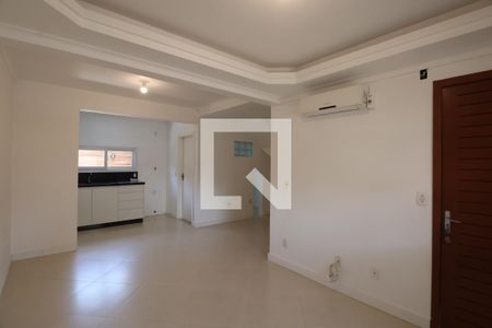 Sala de casa de condomínio à venda com 3 quartos, 110m² em Harmonia, Canoas