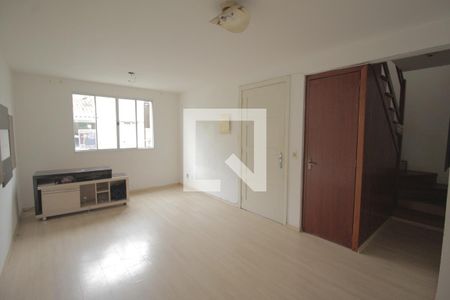 Sala de casa de condomínio à venda com 4 quartos, 107m² em Humaitá, Porto Alegre