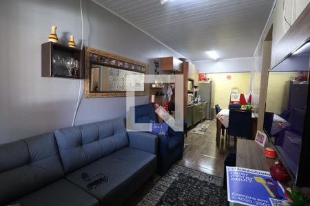 Sala de casa de condomínio à venda com 2 quartos, 48m² em São José, Canoas