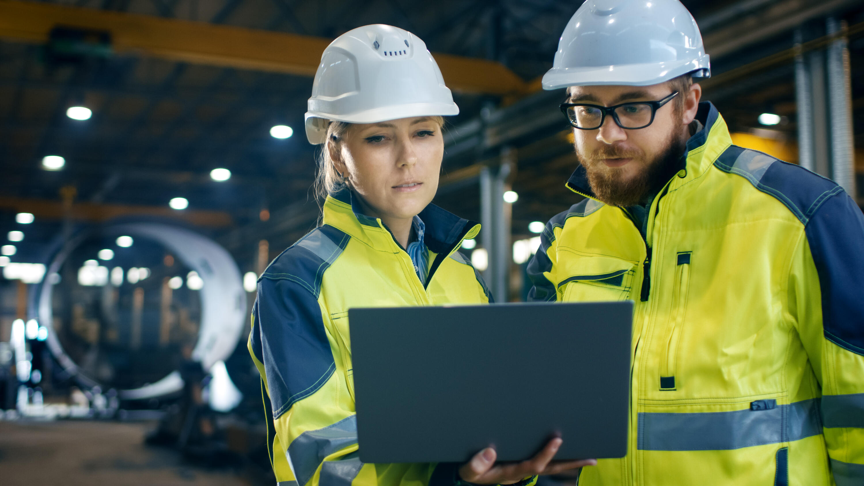 A photo of a man and a woman working as electricians