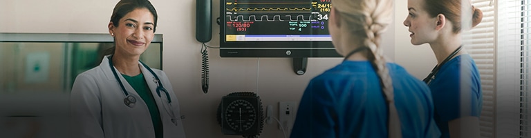 doctor and nursing professionals in a hospital room setting