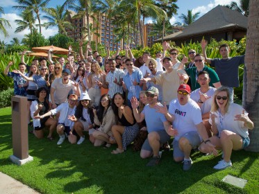 A group photo full of cheering Rokt’stars at an event