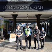 PCSO Hammond (second from left) and City Watch Ranger Andy Milton (third from left) patrolling Old George Mall in Salisbury during Safer Business Action Week with staff from Venture Security