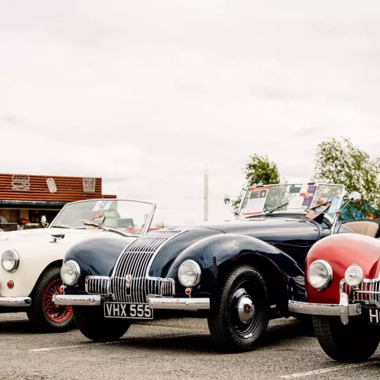 three classic cars