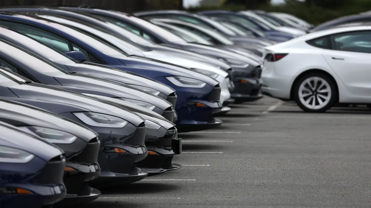 New Tesla vehicles parked on a car lot