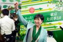 Incumbent Tokyo Governor Yuriko Koike celebrates after she was elected for Tokyo’s gubernatorial election in Tokyo on Sunday (Hiro Komae/AP)