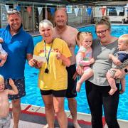 (L-R) Riley & Kit Kennett, Martin Greenway presenting the cheque to Liz Hurry (Chair of WiveyPool) Chris Briggs, and Darcie, Oscar & Charmaine Veryard