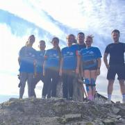 The challenge involves climbing the three highest peaks in Scotland, England, and Wales