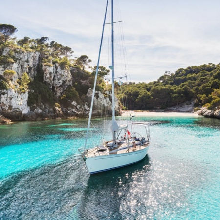 Sailboat in Cala Macarelleta in Menorca, Balearic Islands