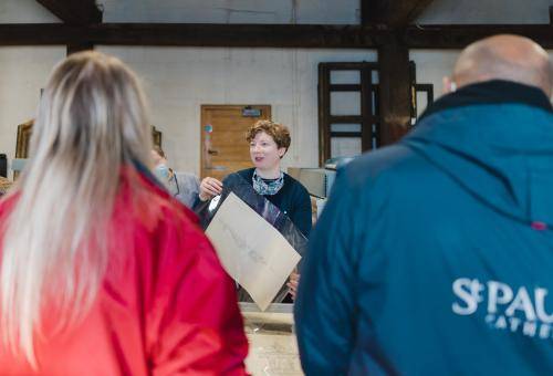 visitors being shown round the collections department