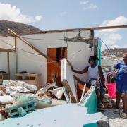 Shermaine Baptiste, left, and a friend look into her destroyed bedroom after it was hit by Hurricane Beryl in Clifton, Union Island, St Vincent and the Grenadines, Thursday, July 4, 2024. Lucanus Ollivierre/AP)