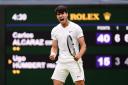 Carlos Alcaraz was pushed hard by Ugo Humbert during a four-set win on Centre Court (John Walton/PA)