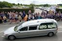 The funeral cortege passes through Featherstone town centre (Peter Byrne/PA)