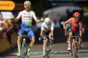 Anthony Turgis celebrates his stage win in front of a frustrated Tom Pidcock in Troyes (Daniel Cole/AP)