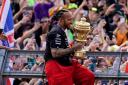 Mercedes’ Lewis Hamilton celebrates with the trophy after his triumph at Silverstone (David Davies/PA)