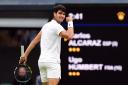 Carlos Alcaraz got the better of Ugo Humbert to reach the Wimbledon quarter-finals (John Walton/PA)