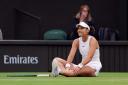 Emma Raducanu took a tumble during her match with Lulu Sun and eventually crashed out of Wimbledon in the fourth round (John Walton/PA)