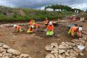 A team of up to 70 archaeologists uncovers a small town that straddled Ermin Street Roman road, one of the key routes in southwestern Roman Britain