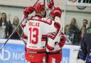 Swindon Wildcats celebrate a goal with captain Sam Bullas