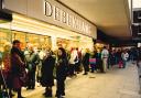 Shoppers queueing for a sale in December 1990