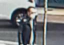 CCTV images show the wanted man waiting for the bus