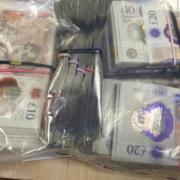 Nearly £80,000 worth of cash was seized in raids