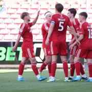 Swindon celebrate their fourth goal against Newport