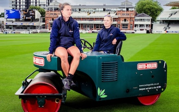 Emma Lynch and Meg Lay sit on tip of the heavy roller