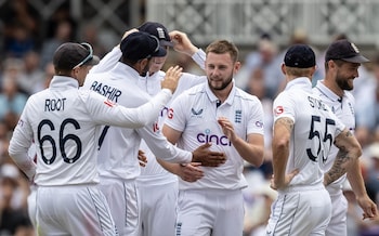 Gus Atkinson celebrates the wicket of Kevin Sinclair