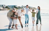 family having fun on beach