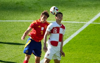 Spain's Robin Le Normand, left, and Croatia's Ante Budimir