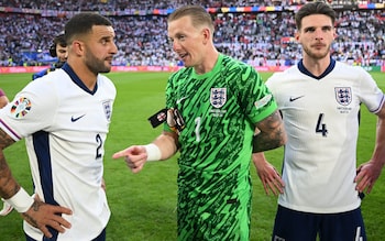 Kyle Walker and Jordan Pickford chat with Declan Rice alongside after their win