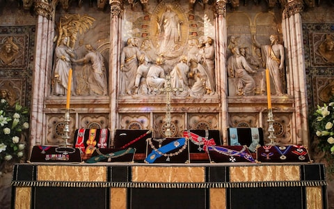 Insignia belonging to Prince Philip are placed on the altar in St George's Chapel, Windsor