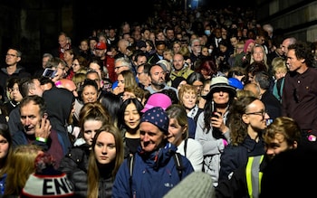 Thousands queue outside St Giles' Cathedral in Edinburgh on Monday to see Queen Elizabeth II lying in rest