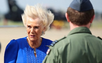 The Queen's hair is blown away from her face as she arrives at a blustery airfield at RAF Leeming in North Yorkshire