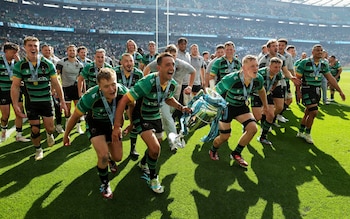 Alex Mitchell and Tom Pearson of Northampton Saints celebrate with the Premiership trophy