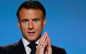 Emmanuel Macron steeples his fingers as he speaks