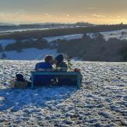 Nicola Cunningham snapped a couple enjoying a romantic picnic on Ditchling Beacon in the snow