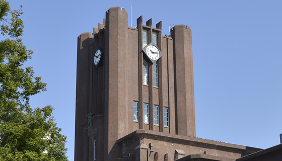 Clock tower building against a blue sky background