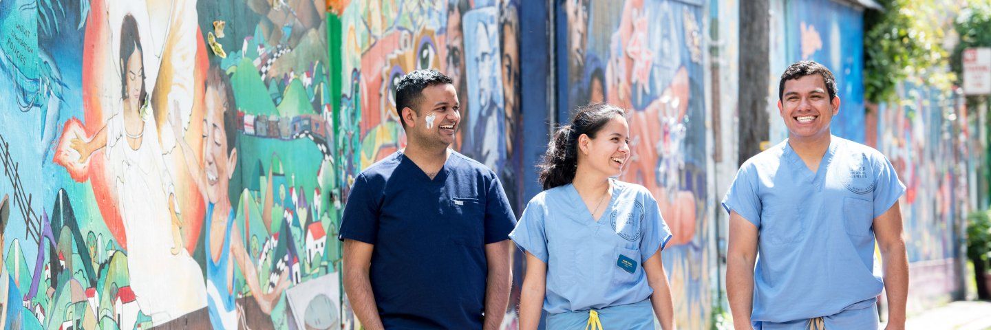 3 UCSF students walking in the Mission