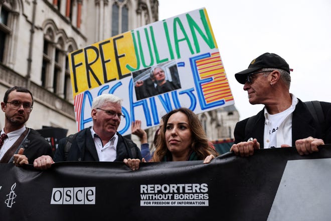 Wife of WikiLeaks founder Julian Assange, Stella Assange (2nd R), flanked by Wikileaks editor in chief Kristinn Hrafnsson (2nd L), takes part in a march from The Royal Courts of Justice, Britain's High Court, in central London on February 21, 2024, on the second day of a UK appeal by the WikiLeaks founder Assange against his extradition to the US. Lawyers for the United States urged a UK court to block a last-ditch bid by Julian Assange to appeal his extradition there to face espionage charges on February 21, 2024. Washington indicted the WikiLeaks founder multiple times between 2018 and 2020 over its publication of hundreds of thousands of secret military and diplomatic files on the US-led wars in Iraq and Afghanistan.