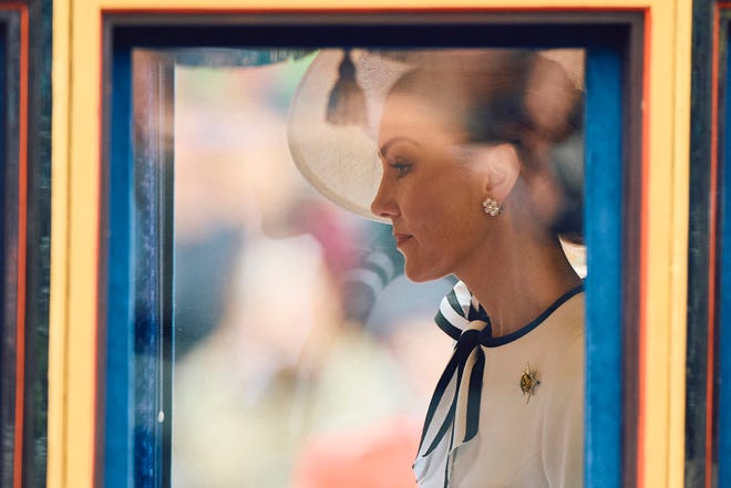 Britain's Catherine, Princess of Wales, rides the Glass State Coach at Horse Guards Parade during the King's Birthday Parade "Trooping the Colour" in London on June 15, 2024. Catherine, Princess of Wales, is making a tentative return to public life for the first time since being diagnosed with cancer, attending the Trooping the Colour military parade in central London.
