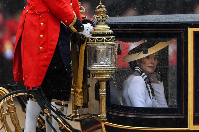 Britain's Catherine, Princess of Wales, rides inside the Glass State Coach at Horse Guards Parade after the King's Birthday Parade "Trooping the Colour" in London on June 15, 2024. Catherine, Princess of Wales, is making a tentative return to public life for the first time since being diagnosed with cancer, attending the Trooping the Colour military parade in central London.