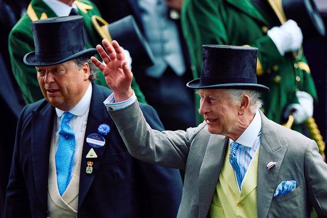 Britain's King Charles III waves to members of the public as he attends the first day of the Royal Ascot horse racing meeting, in Ascot, west of London, on June 18, 2024.